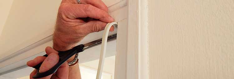 Applying Weather Stripping to Frame Door