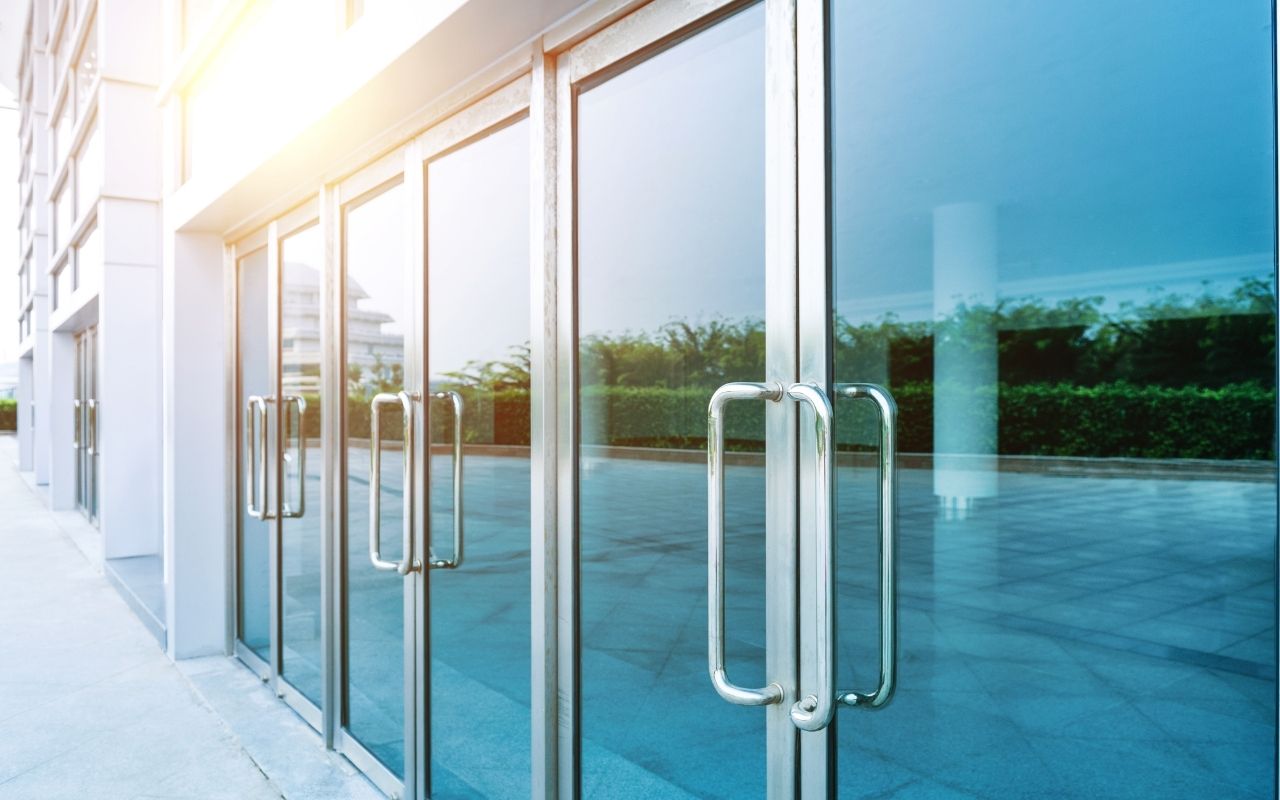 Modern office entryway with double glass doors