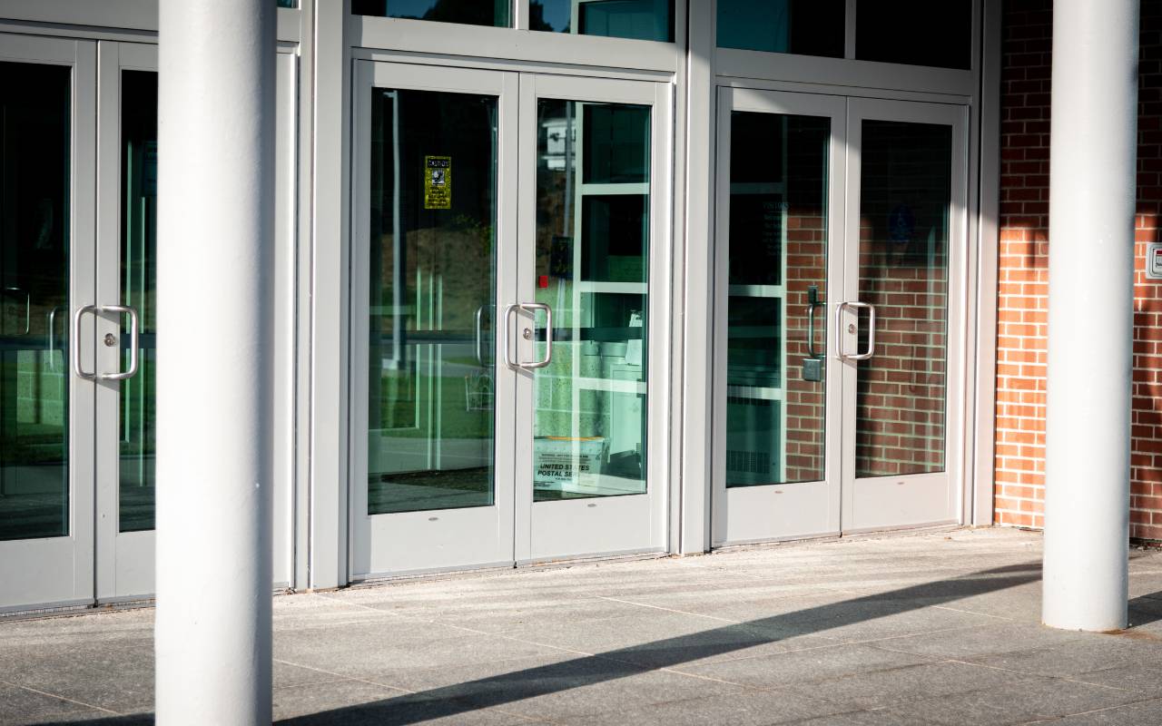 Weather stripping on commercial doors improving energy efficiency